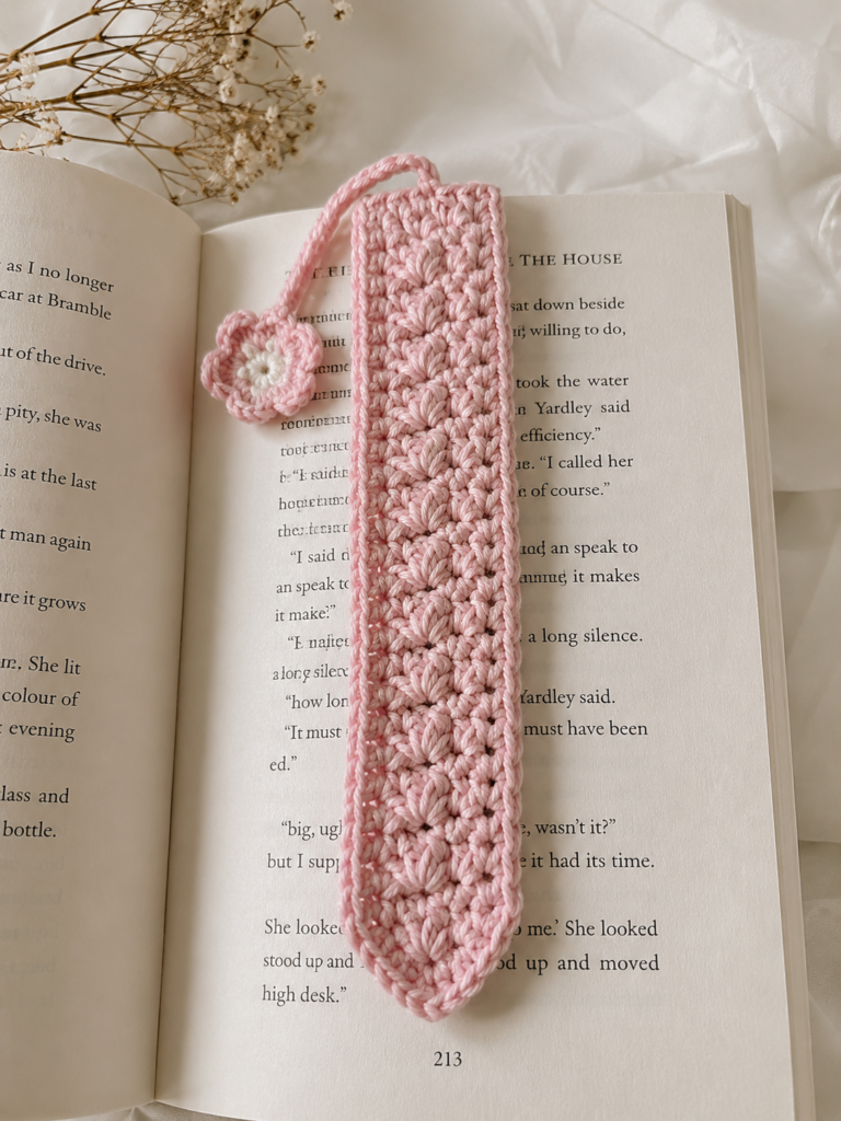 cute pink crochet bookmark handmade mothers day gift idea inside an open book
