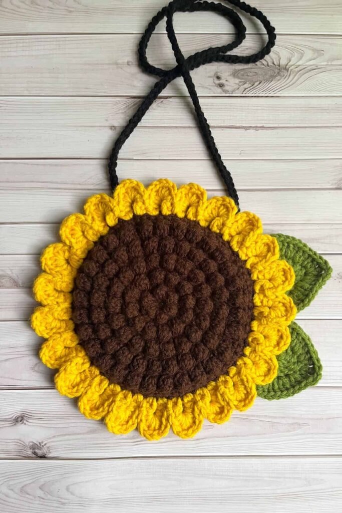 Cute crochet sunflower purse tutorial with yellow sunflower design and coquette handmade aesthetic